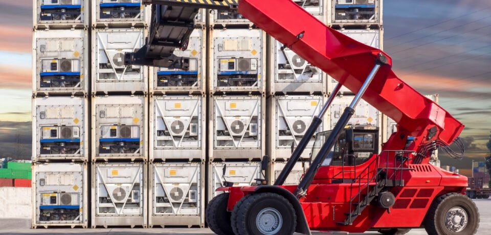 Reachstacker standby for pick up the reefer container at container yard.