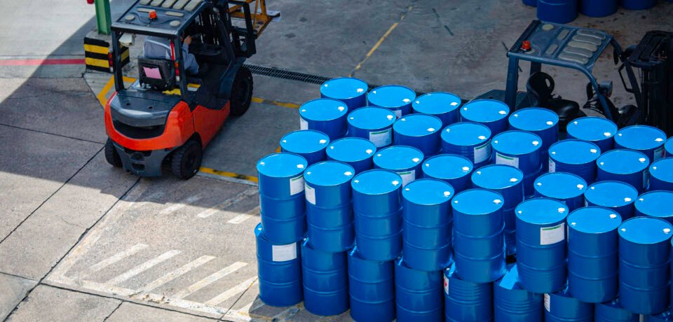 Top view oil barrels forklift truck move for on the transportation worker help arrange.